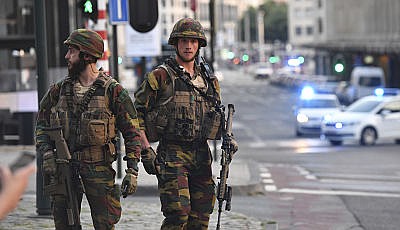 Belgian Army soldiers patrol outside Central Station after a reported explosion in Brussels on Tuesday, June 20, 2017. Belgian media are reporting that explosion-like noises have been heard at a Brussels train station, prompting the evacuation of a main square.