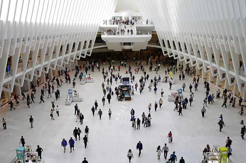 In this Thursday, June 15, 2017, photo, people walk inside the Oculus, the new transit station at the World Trade Center in New York. Researchers are gearing up to start recruiting 10,000 New Yorkers early next year for a study so sweeping it's called "The Human Project." They'll be asked to share a trove of personal information, from cellphone locations and credit-card swipes to blood samples and life-changing events. For 20 years. The idea is to channel different data streams into a river of insight on health, aging, education and many other aspects of human life. 