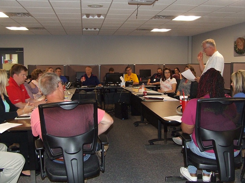 The Moniteau Regional Economic Development organization meeting met a week early and at a different location  Burgers' Smokehouse  just for the month of June. Mike Kelley, standing, newly elected president and CEO of MRED, addressed the meeting Wednesday, June 7, 2017.