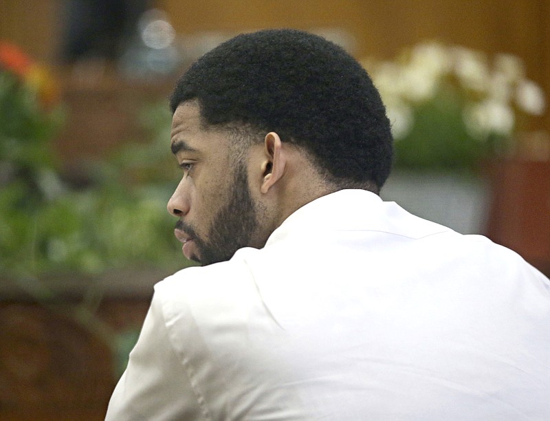 Dominique Heaggan-Brown listens to the statement he made to investigators after the shooting is read back to him in court by Special Agent Raymond Gibbs of the Wisconsin Department of Justice, Friday, June 16, 2017, in Milwaukee. Heaggan-Brown, a former Milwaukee police officer on trial in a fatal shooting that sparked riots in a predominantly black neighborhood, said Friday he will not testify, as his attorneys prepare to begin presenting his defense.
