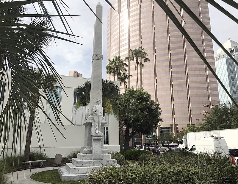 A Confederate statue is seen in a small park in Tampa, Fla., Wednesday, June 21, 2017. The Hillsborough County Commission is scheduled to discuss the fate of the statue that was first erected in Tampa in 1911 in front of the courthouse. A commissioner has called for its removal. (AP Photo/Tamara Lush)