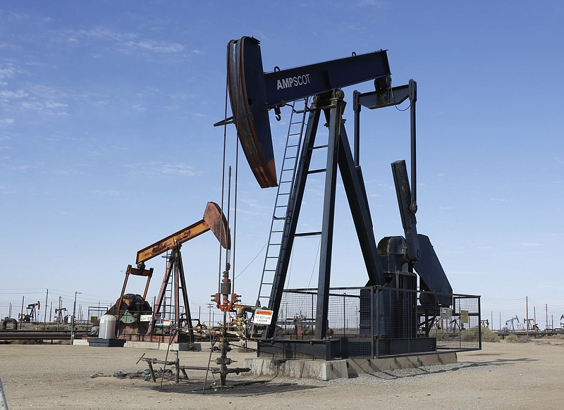 FILE -- In this Aug. 4, 2013, file photo, an oil field pump jack operates near Lost Hills, Calif. California's cap-and-trade law, which puts a cap and a price on carbon emissions, expires in 2020. Gov. Jerry Brown say he's still hopeful it will be extended, after he failed to convince lawmakers to extend it in tandem with the just-passed state budget. (AP Photo/Rich Pedroncelli, File)