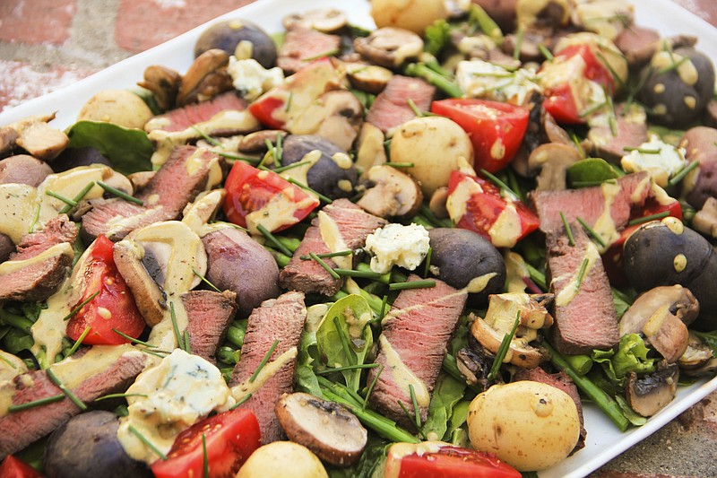 This June 12, 2017 photo shows a meat and potatoes steakhouse salad in Coronado, Calif. This dish is from a recipe by Melissa d'Arabian. 