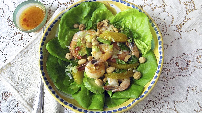 This June 15, 2017 photo shows a shrimp, avocado and orange salad with spicy orange dressing in New York. This dish is from a recipe by Sara Moulton. 