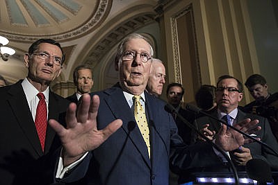 Senate Majority Leader Mitch McConnell, R-Ky., joined by, from left, Sen. John Barrasso, R-Wyo., Sen. John Thune, R-S.D., and Majority Whip John Cornyn, R-Texas, speaks following a closed-door strategy session, at the Capitol in Washington, Tuesday, June 20, 2017. Sen. McConnell says Republicans will have a "discussion draft" of a GOP-only bill scuttling former President Barack Obama's health care law by Thursday.