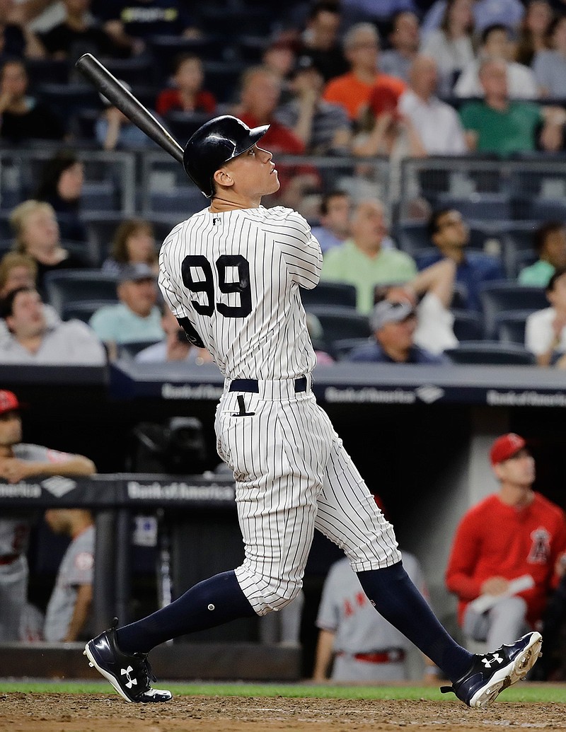 New York Yankees' Aaron Judge watches his home run during the fifth inning of the team's baseball game against the Los Angeles Angels on Tuesday, June 20, 2017, in New York. 