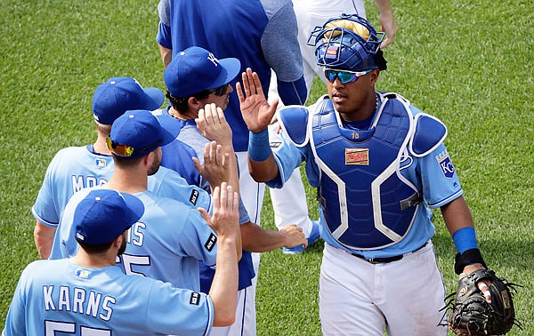 Salvador Perez celebrates with his Royals teammates after Wednesday afternoon's 6-4 victory against the Red Sox at Kauffman Stadium.