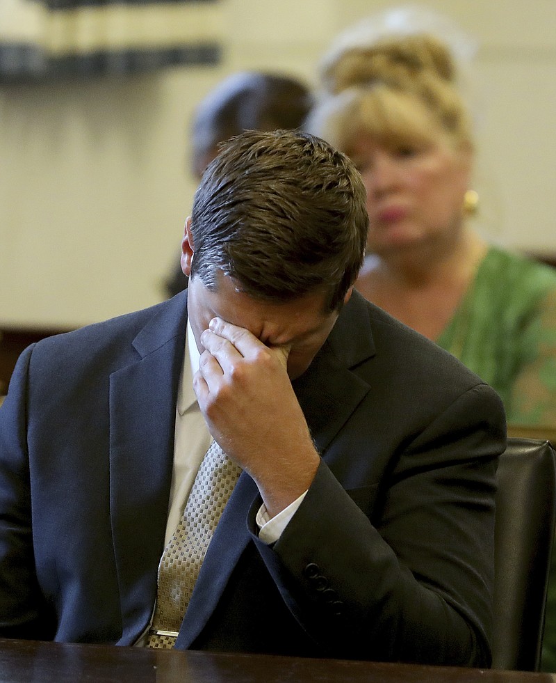 Former University of Cincinnati police officer Raymond Tensing reacts as Hamilton County Common Pleas Judge Leslie Ghiz declares a mistrial on Friday, June 23, 2017 in Cincinnati.  Tensing was charged with murder and voluntary manslaughter in the shooting of unarmed black motorist Sam DuBose during a 2015 traffic stop. (Cara Owsley /The Cincinnati Enquirer via AP, Pool)