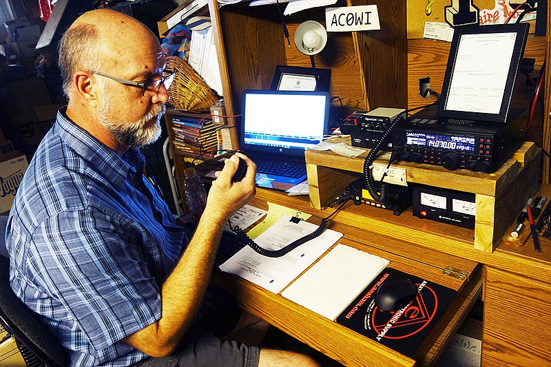 Callaway Amateur Radio League member David Mueller shows off his rig, which includes a radio that can broadcast to the far side of the world by bouncing radio waves off the ionosphere. He and other league members will participate in a disaster preparedness exercise this weekend in Kingdom City.