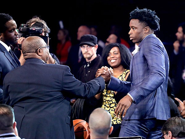 Indiana's OG Anunoby, a former Jefferson City Jay, celebrates with relatives and friends Thursday night after being selected by the Raptors as the 23rd overall pick of the NBA draft. 