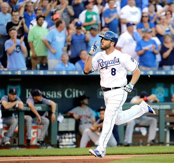 Mike Moustakas of the Royals celebrates as he crosses the plate after hitting a solo home run during Tuesday's game against the Red Sox Tuesday at Kauffman Stadium.