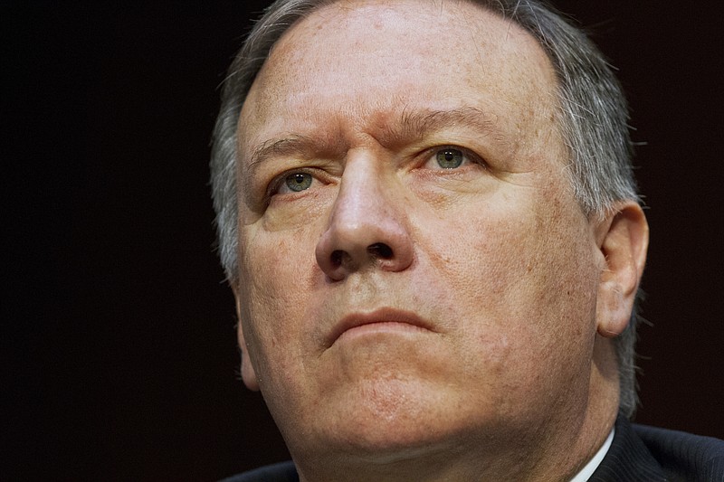 FILE - In the May 11, 2017 file photo, CIA Director Mike Pompeo listens while testifying on Capitol Hill in Washington. In an interview that aired Saturday, Pompeo says he thinks the disclosure of America's secret intelligence is on the rise, fueled partly by the "worship" of leakers like Edward Snowden. (AP Photo/Jacquelyn Martin, File)