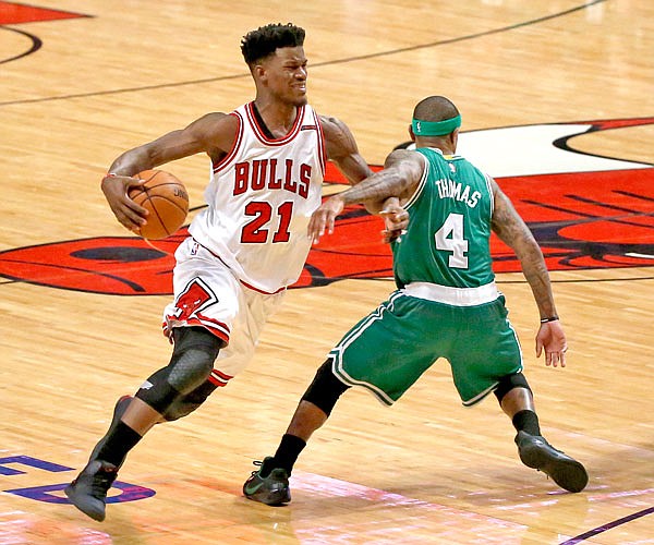 In this April 23 file photo, Bulls guard Jimmy Butler is fouled by Celtics guard Isaiah Thomas during Game 4 of a first-round playoff series in Chicago. The Bulls traded Butler, a three-time All-Star, to the Timberwolves on Thursday.