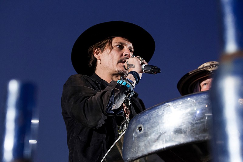 Actor Johnny Depp introduces a film at the Glastonbury music festival at Worthy Farm, in Somerset, England, Thursday, June 22, 2017. 