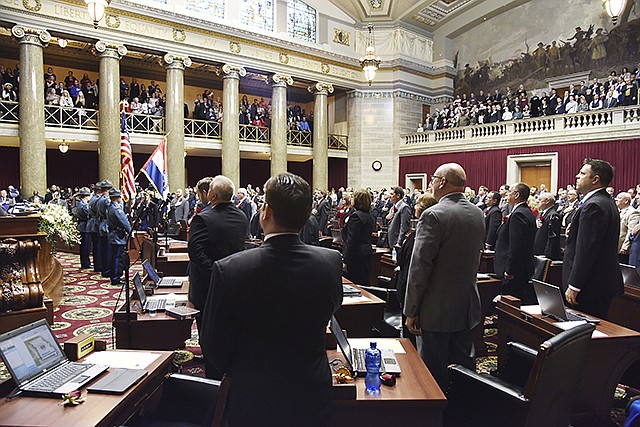 Members of the Missouri House of Representatives stand for the Pledge of Allegiance in January 2017 during ceremonies as the 99th General Assembly gets underway.