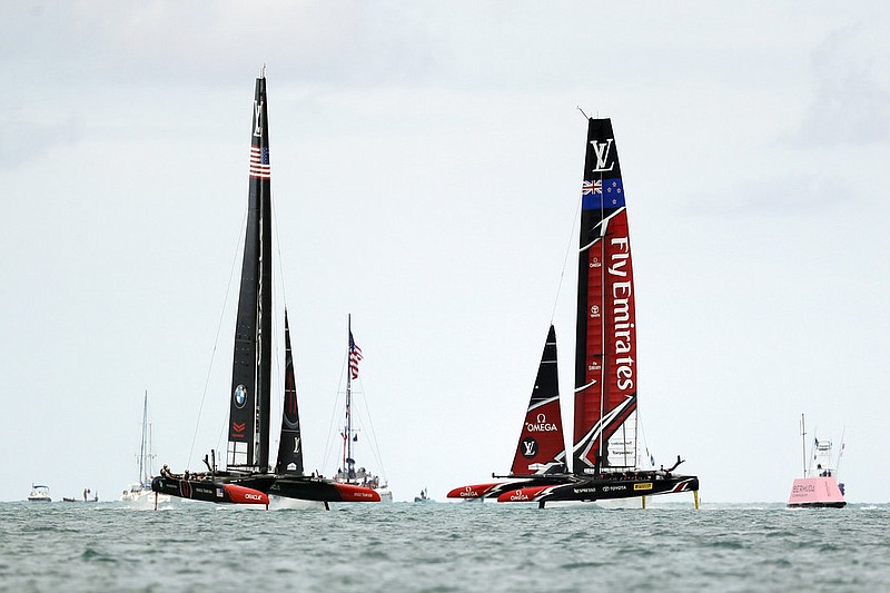 Emirates Team New Zealand, right, races Oracle Team USA during the sixth race of America's Cup sailing competition Saturday, June 24, 2017, in Hamilton, Bermuda.