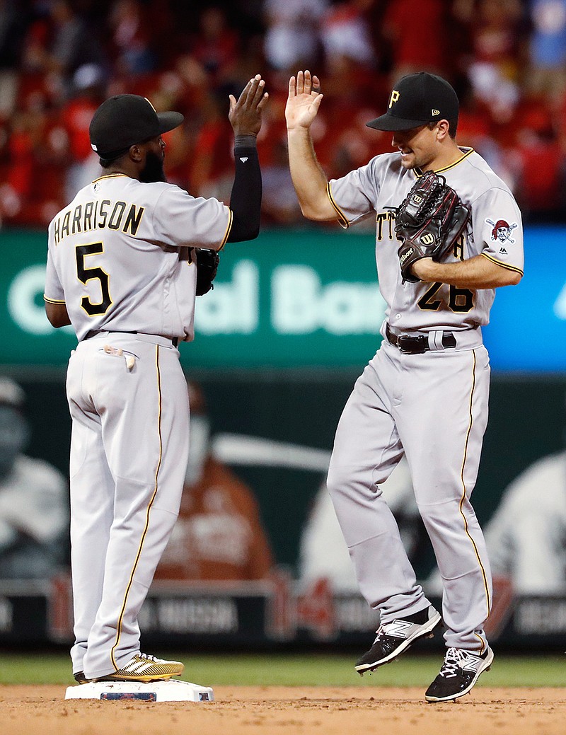 Pittsburgh Pirates' Adam Frazier, right, and Josh Harrison celebrate following the team's baseball game against the St. Louis Cardinals on Saturday, June 24, 2017, in St. Louis. The Pirates won 7-3. 