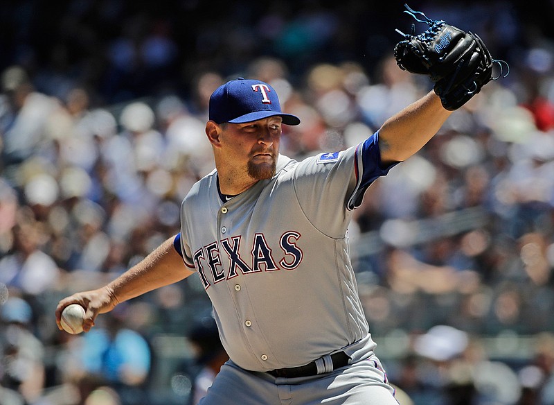 Texas Rangers' Austin Bibens-Dirkx delivers a pitch during the first inning of a baseball game against the New York Yankees Saturday, June 24, 2017, in New York. 