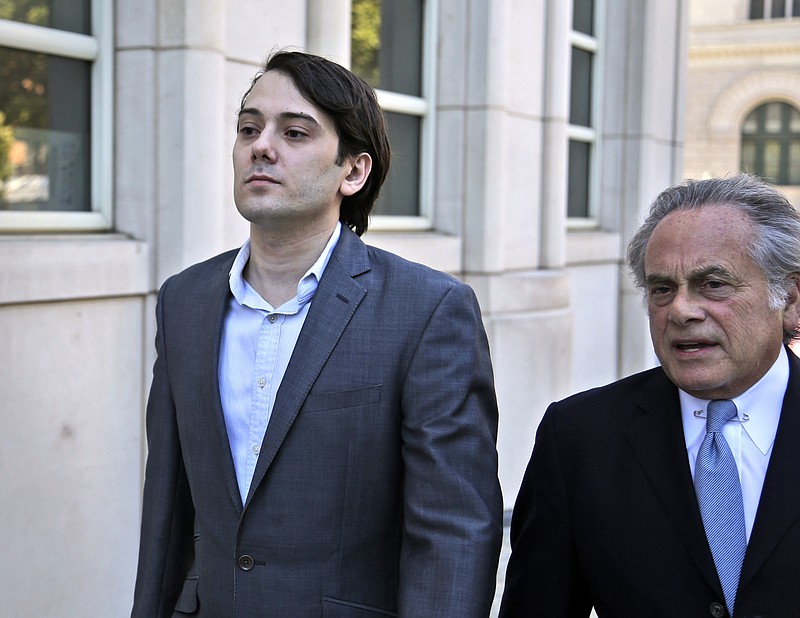 Former Turing Pharmaceuticals CEO Martin Shkreli, left, arrives to federal court with his attorney Benjamin Brafman in New York, Monday, June 26, 2017. Even with his federal securities fraud trial set to begin Monday, Shkreli has blatantly defied his attorneys' advice to lay low. (AP Photo/Seth Wenig)