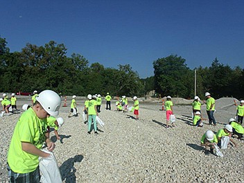 <p>Submitted</p><p>Students search through rocks at Capital Materials quarry as part of the Kids Rock program.</p>