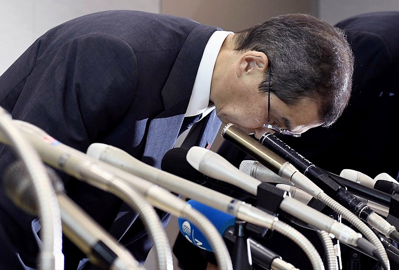 Japanese air bag maker Takata Corp. CEO Shigehisa Takada bows at the beginning of a press conference in Tokyo, Monday, June 26, 2017.  Takata Corp. has filed for bankruptcy protection in Tokyo and the U.S., overwhelmed by lawsuits and recall costs related to its production of defective air bag inflators. (Akiko Matsushita/Kyodo News via AP)