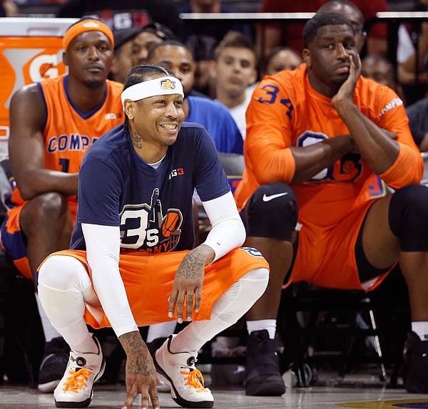 3's Company player/captain and coach Allen Iverson kneels on the sideline during the first half of Game 3 in the BIG3 Basketball League debut Sunday at the Barclays Center in New York.