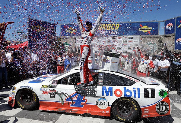 Kevin Harvick celebrates after winning the NASCAR Sprint Cup Series race Sunday in Sonoma, Calif.