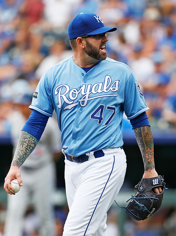 Royals relief pitcher Peter Moylan yells at home plate umpire John Tumpane as he reacts to a called ball with the bases loaded in the sixth inning of Sunday's game against the Jays at Kauffman Stadium in Kansas City.