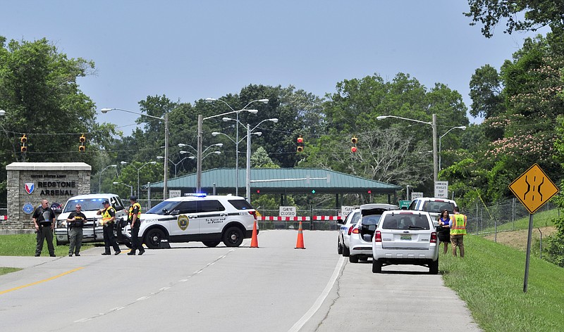 <p>AP</p><p>Madison County Sheriff’s deputies and Huntsville Police officers block Martin Road leading to Redstone Arsenal Gate 1 in Huntsville, Ala. Authorities locked down the Alabama military post Tuesday amid reports of possible active shooter, and workers were advised to “run hide fight.”</p>