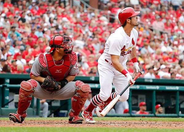 Cardinals left fielder Randal Grichuk and Reds catcher Devin Mesoraco watch Grichuk's two-run home run during the fourth inning of Monday's game in St. Louis.