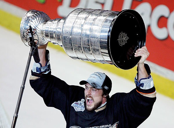 In this June 6, 2007, file photo, Ducks right wing Teemu Selanne raises the Stanley Cup after winning Game 5 of the Stanley Cup final against the Senators in Anaheim, Calif.