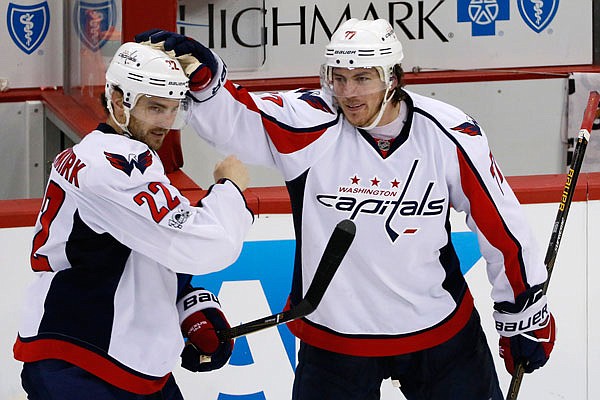 In this May 1 file photo, Kevin Shattenkirk (left) of the Capitals celebrates with T.J. Oshie after scoring the game-winning goal in overtime of Game 3 in the Eastern Conference semifinals against the Penguins in Pittsburgh.