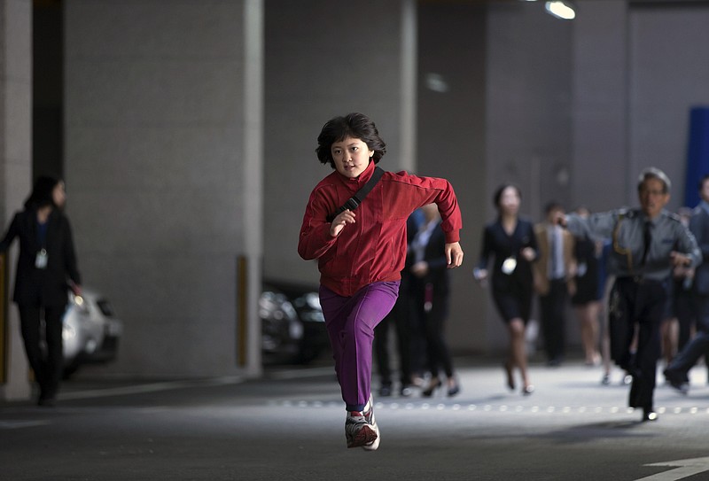 This image released by Netflix shows Seo-Hyun Ahn in a scene from "Okja." (Jae Hyuk Lee/Netflix via AP)