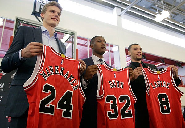 Bulls seventh overall draft pick Lauri Markkanen (left), Kris Dunn (center) and Zach Levine pose for a photo at the team's training facility Tuesday in Chicago.