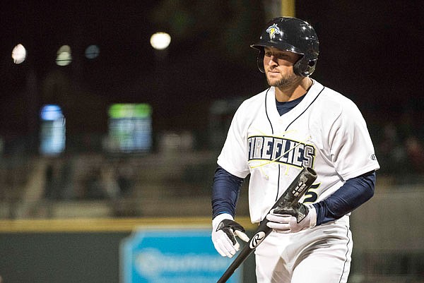 In this April 6 file photo, Columbia Fireflies' Tim Tebow returns to the dugout after striking out during the team's minor league baseball game against the Augusta GreenJackets, in Columbia, S.C.