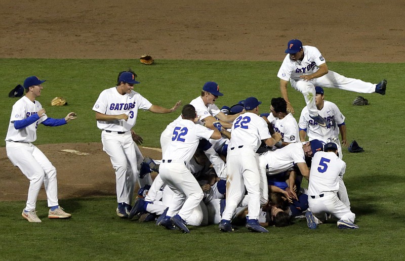 Florida players celebrate after defeating LSU in Game 2 to win the NCAA College World Series baseball finals in Omaha, Neb., Tuesday, June 27, 2017. 