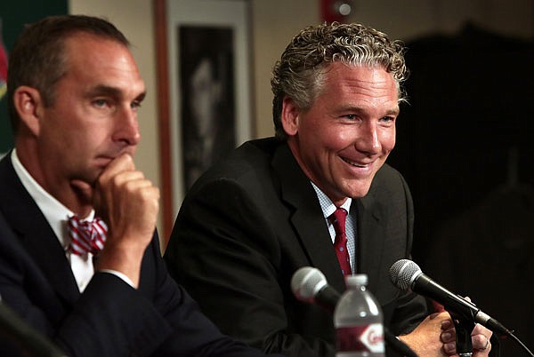 John Mozeliak (left), newly named Cardinals president of baseball operations, and new general manager Mike Girsch speak during a news conference Friday at Busch Stadium.