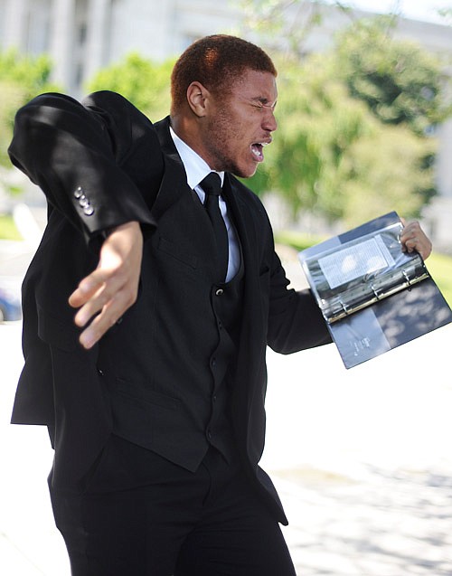 Mitchell Huston performs his dramatic reading of "Not a Genuine Black Man," by Brian Copeland in front of the Missouri State Capitol in Jefferson City on Friday, June 30, 2017.