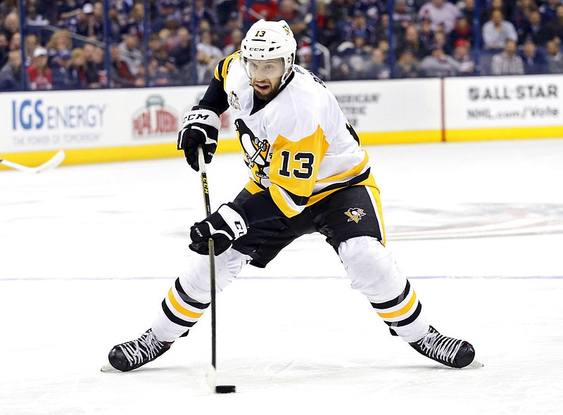  In this Dec. 22, 2016, file photo, Pittsburgh Penguins' Nick Bonino plays against the Columbus Blue Jackets during an NHL hockey game in Columbus, Ohio. The Western Conference-champion Nashville Predators took care of an area of concern, signing center Nick Bonino away from the Stanley Cup champion Penguins with a $16.4 million, four-year contract on Saturday, July 1, 2017.