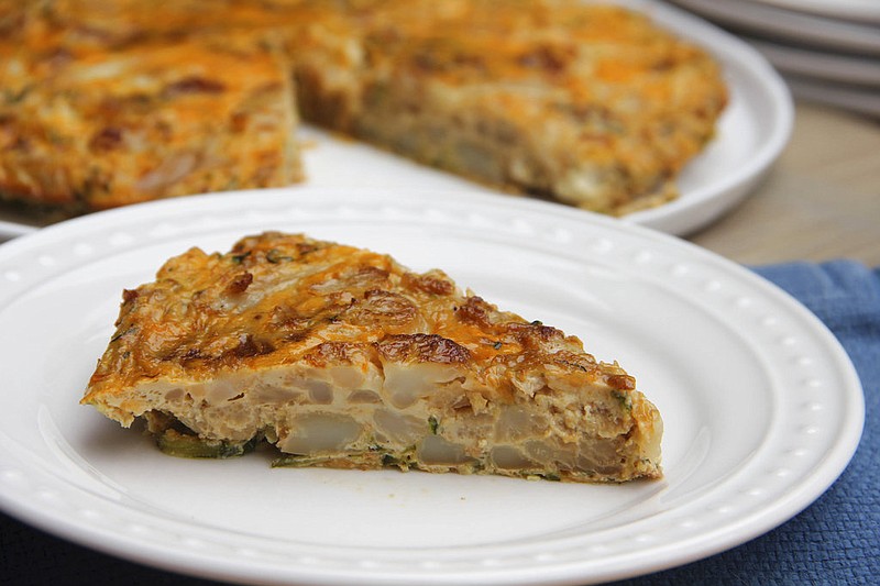 This June 24, 2017 photo shows a lightened sweet zucchini and chorizo Spanish tortilla in Coronado, Calif. This dish is from a recipe by Melissa d'Arabian. (Melissa d'Arabian via AP)