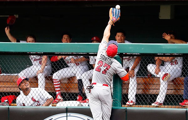 Marlins right fielder Giancarlo Stanton is unable to catch a two-run home run hit by Greg Garcia of Cardinals during the fifth inning of Tuesday afternoon's game at Busch Stadium.