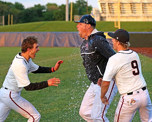 Jefferson City coach Brian Ash is doused with water after the Jays won the district title against Rock Bridge in 2016 in Columbia.