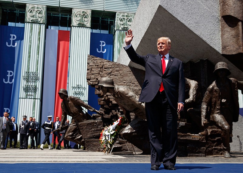 President Donald Trump waves as he arrives to deliver a speech at Krasinski Square at the Royal Castle, Thursday, July 6, 2017, in Warsaw.