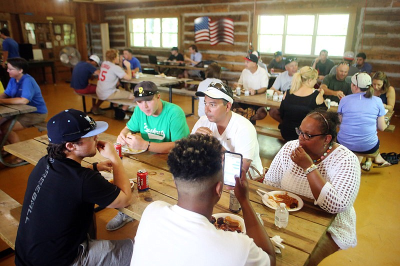 Joyce Million, right, and Mike Million sit with Jefferson City Renegade players Mike Million and Branden Beeler on Saturday, July 8, 2017 during a cookout for host families, players and player families at Timber Acres. The cookout served as a thank you to everyone who helped with the team's summer season.