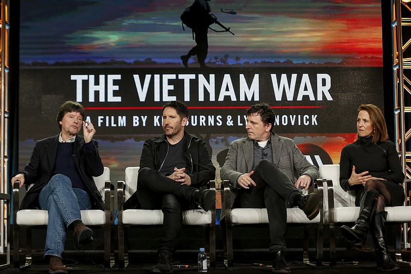 FILE - In this Sunday, Jan. 15, 2017, file photo, Ken Burns, from left, Trent Reznor, Atticus Ross and Lynn Novick speak at PBS' "The Vietnam War" panel at the 2017 Television Critics Association press tour in Pasadena, Calif. The public TV service said its fall lineup will be anchored by Burns' "The Vietnam War," a 10-part documentary debuting Sept. 17. (Photo by Willy Sanjuan/Invision/AP, File)