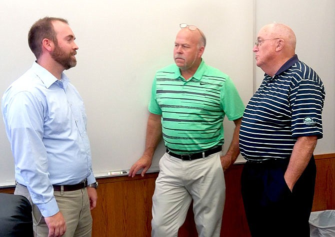 Dan Bradley, left, the new senior resident inspector at the Callaway Energy Center, met with local government officials including Presiding County Commissioner Gary Jungermann and Fulton Mayor LeRoy Benton on Tuesday. 