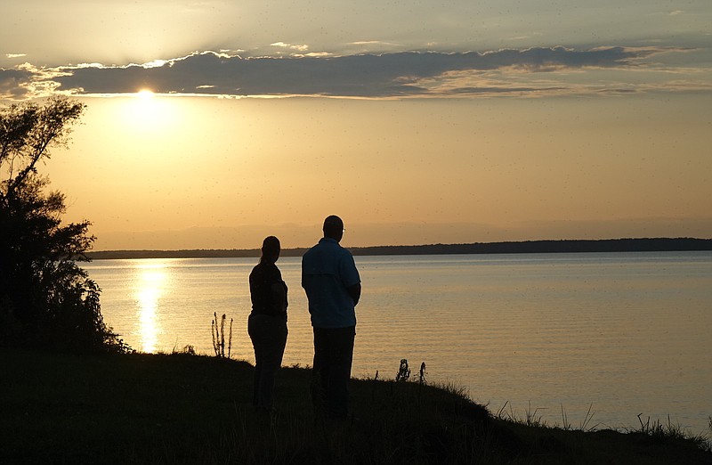  A couple watch the sunset at Wright Patman Lake.