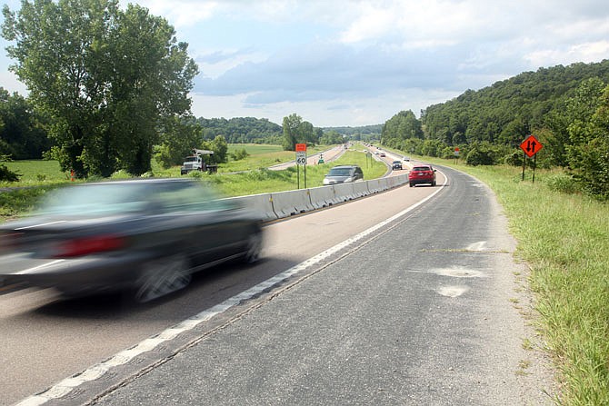 Cars travel head to head on U.S. 63 on Thursday over the Katy Trail north of Jefferson City. Construction crews plan to pour the bridge deck on the south side of the highway tonight. Both lanes should be open by Aug. 21.