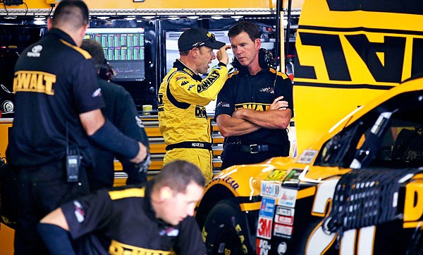 Matt Kenseth gestures as he talks with crew chief Jason Ratcliff in his team's garage after a practice session Friday at the New Hampshire Motor Speedway in Loudon, N.H.