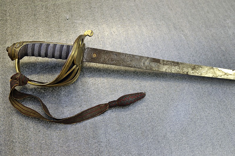 In this July 14, 2017 photo taken at the Massachusetts Historical Society in Boston, the sword that belonged to Col. Robert Gould Shaw, the commanding officer of the first all-black regiment raised in the North during the Civil War is seen. The sword, stolen after Shaw was killed during the 54th Massachusetts Voluntary Infantry's attack on Fort Wagner, South Carolina in 1863, was recently found in the attic of a Boston-area home. (AP Photo/Elise Amendola)